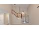 Spacious entryway featuring staircase, neutral paint, and wood-look flooring at 430 Tara Oaks Ct, Lawrenceville, GA 30043