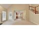 Open-concept living room with view into kitchen, light-colored walls, and ample natural light at 430 Tara Oaks Ct, Lawrenceville, GA 30043