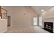 Inviting living room with a cozy fireplace, neutral walls, and plush carpeting at 430 Tara Oaks Ct, Lawrenceville, GA 30043