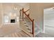 Cozy living room with a fireplace, large windows, and access to the stairway at 430 Tara Oaks Ct, Lawrenceville, GA 30043