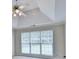 Spacious main bedroom with a tray ceiling, ceiling fan, and large windows at 430 Tara Oaks Ct, Lawrenceville, GA 30043