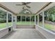 Enclosed porch featuring tile flooring and walls of windows for natural light at 430 Tara Oaks Ct, Lawrenceville, GA 30043