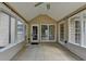 Covered porch featuring tile flooring and great natural light at 430 Tara Oaks Ct, Lawrenceville, GA 30043