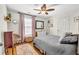 This bedroom offers hardwood floors, neutral colors, natural light, and comfortable furniture at 2455 Stonevalley Ln, Cumming, GA 30041