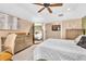 Bright bedroom featuring a ceiling fan, carpeted floor, and neutral walls to enhance the relaxing space at 2455 Stonevalley Ln, Cumming, GA 30041