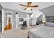 This bedroom features a desk, sloped ceiling, natural light, carpet, and a closet at 2455 Stonevalley Ln, Cumming, GA 30041