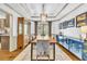 Formal dining room with elegant chandelier, hardwood floors, and tray ceiling at 2455 Stonevalley Ln, Cumming, GA 30041