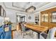 Elegant dining room features tray ceiling, modern chandelier, and stylish furnishings at 2455 Stonevalley Ln, Cumming, GA 30041