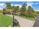 Beautiful home exterior with manicured lawn, long driveway, and mature trees at 2455 Stonevalley Ln, Cumming, GA 30041