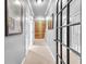 Bright hallway with glass-paneled doors, neutral carpet, and stylish decor to a naturally lit living space at 2455 Stonevalley Ln, Cumming, GA 30041