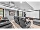 Luxurious home theater with plush seating, projector screen, and professional sound system at 2455 Stonevalley Ln, Cumming, GA 30041