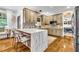 Bright kitchen featuring an island with marble countertop and stainless steel appliances at 2455 Stonevalley Ln, Cumming, GA 30041
