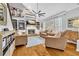 Cozy living room with a fireplace, built-in shelving, and large windows for natural light at 2455 Stonevalley Ln, Cumming, GA 30041