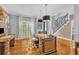 Stylish home office with modern lighting, hardwood floors, and neutral walls at 2455 Stonevalley Ln, Cumming, GA 30041