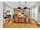 Elegant home office with custom built-ins, brick accent wall, and hardwood floors at 2455 Stonevalley Ln, Cumming, GA 30041