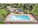 Aerial view of a community pool surrounded by lounge chairs and umbrellas at 2455 Stonevalley Ln, Cumming, GA 30041