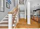 Grand staircase with modern railing, leading to the upper level of the home at 2455 Stonevalley Ln, Cumming, GA 30041