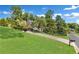Beautiful home with a large lawn and mature trees, perfect for outdoor activities at 2455 Stonevalley Ln, Cumming, GA 30041