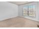 Bedroom featuring neutral walls, carpet, and a window with blinds at 3028 Sw Deerborne Court Sw Ct, Atlanta, GA 30331