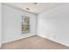 Bright bedroom features a large window and neutral carpet at 3028 Sw Deerborne Court Sw Ct, Atlanta, GA 30331