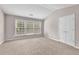 Bright bedroom features large windows, neutral carpet, and a vaulted ceiling at 3028 Sw Deerborne Court Sw Ct, Atlanta, GA 30331
