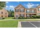 Charming two-story townhouse with black shutters and a well-maintained front lawn at 3028 Sw Deerborne Court Sw Ct, Atlanta, GA 30331