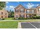 Charming townhome with neutral siding, black shutters, and well-maintained landscaping at 3028 Sw Deerborne Court Sw Ct, Atlanta, GA 30331