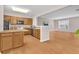 Open kitchen with wood cabinets, stainless steel appliances, and a breakfast bar at 3028 Sw Deerborne Court Sw Ct, Atlanta, GA 30331