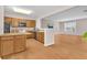 Well-lit kitchen with ample cabinet space, island with seating, and modern appliances at 3028 Sw Deerborne Court Sw Ct, Atlanta, GA 30331
