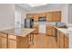 Functional kitchen featuring wood cabinets, black appliances, and ample counter space at 3028 Sw Deerborne Court Sw Ct, Atlanta, GA 30331