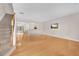 Bright living room featuring hardwood floors, stairs, and an open layout at 3028 Sw Deerborne Court Sw Ct, Atlanta, GA 30331