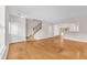 Spacious open-concept living area featuring gleaming hardwood floors and neutral walls at 3028 Sw Deerborne Court Sw Ct, Atlanta, GA 30331