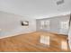 Light-filled living room showcasing beautiful hardwood floors and a neutral color palette at 3028 Sw Deerborne Court Sw Ct, Atlanta, GA 30331