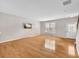 Spacious living room with hardwood floors, window, and ample natural light at 3028 Sw Deerborne Court Sw Ct, Atlanta, GA 30331