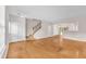 Open-concept living area with hardwood floors, stairs, and natural light at 3028 Sw Deerborne Court Sw Ct, Atlanta, GA 30331