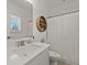 Clean bathroom with a large mirror and modern fixtures, including a toilet and a shower with curtain at 630 Brashy St, Woodstock, GA 30188