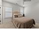 Cozy bedroom featuring plush carpet, neutral colors, and natural light coming through shuttered windows at 630 Brashy St, Woodstock, GA 30188