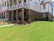 Manicured lawn and charming landscaping adorn the front yard of this inviting home at 630 Brashy St, Woodstock, GA 30188