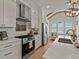 Well-equipped kitchen with stainless steel appliances, white cabinets, and stylish finishes at 630 Brashy St, Woodstock, GA 30188