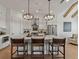 Spacious white kitchen with an island, pendant lighting, and modern appliances at 630 Brashy St, Woodstock, GA 30188