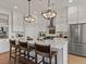 Beautiful kitchen with a large island, stainless steel appliances, and stylish pendant lighting at 630 Brashy St, Woodstock, GA 30188