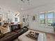 Inviting living room with a comfortable sofa and an open layout to the kitchen at 630 Brashy St, Woodstock, GA 30188