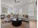 Inviting living room featuring a plush sectional sofa, area rug, and natural light at 630 Brashy St, Woodstock, GA 30188