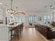 Living room blends seamlessly with the kitchen and features hardwood floors, neutral colors, and modern fixtures at 630 Brashy St, Woodstock, GA 30188