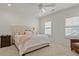 Serene bedroom with plush carpeting, neutral tones, and natural light from shuttered windows at 630 Brashy St, Woodstock, GA 30188