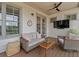 Relaxing patio featuring a comfortable seating area and mounted television, great for enjoying the outdoors at 630 Brashy St, Woodstock, GA 30188