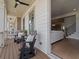 Cozy outdoor porch with rocking chairs and a view into the living area at 630 Brashy St, Woodstock, GA 30188