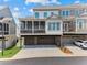 Rear of home with screened porch above the garage offering privacy and functionality at 630 Brashy St, Woodstock, GA 30188