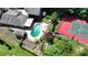 Aerial shot featuring a sparkling pool, tennis court, and outdoor recreational areas at 1024 Lake Charles Dr, Roswell, GA 30075