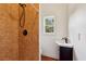 Bathroom featuring shower, tile flooring, and corner sink at 1024 Lake Charles Dr, Roswell, GA 30075